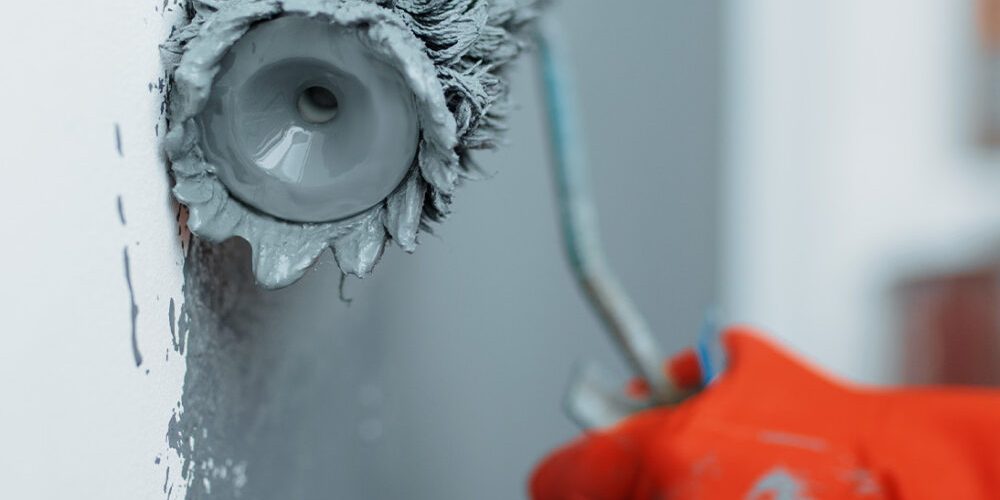 female-house-painter-hand-with-paint-roller-2024-12-05-12-55-08-utc